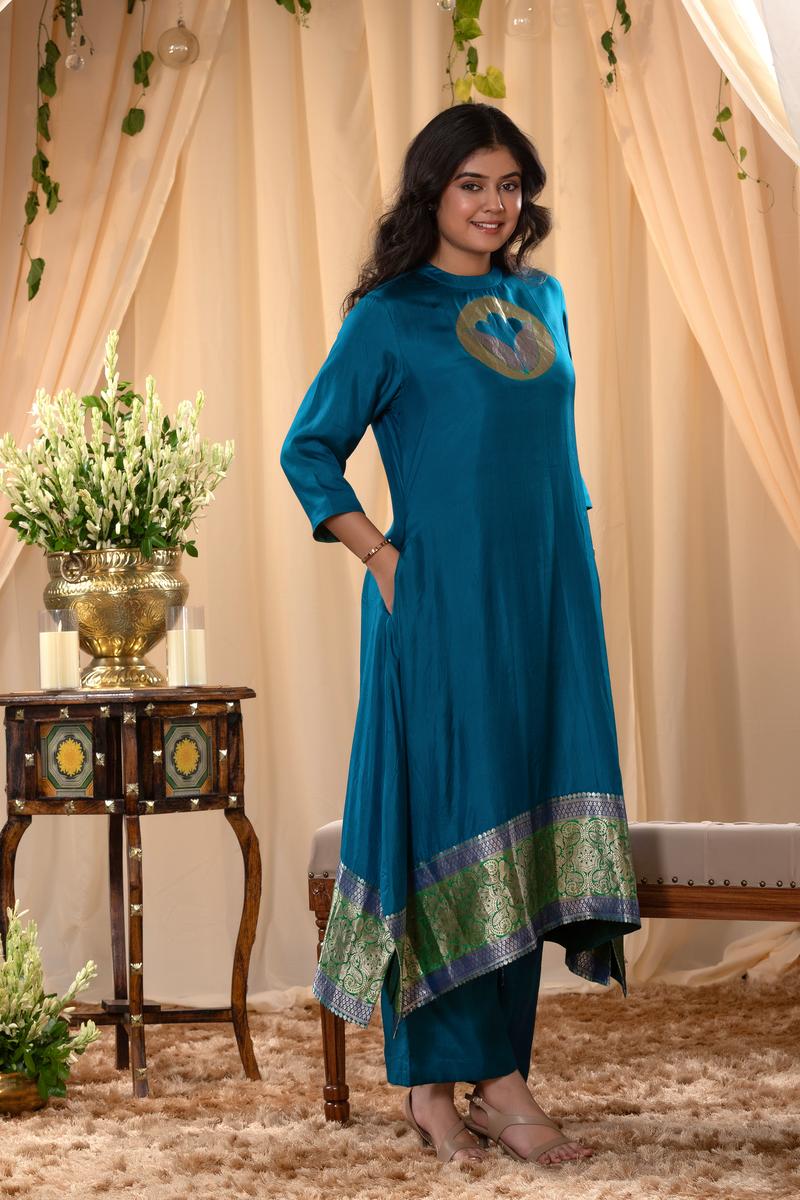 A woman in a blue traditional Kurti co-ord set standing. blue Wedding Kurti Salwar Suit 