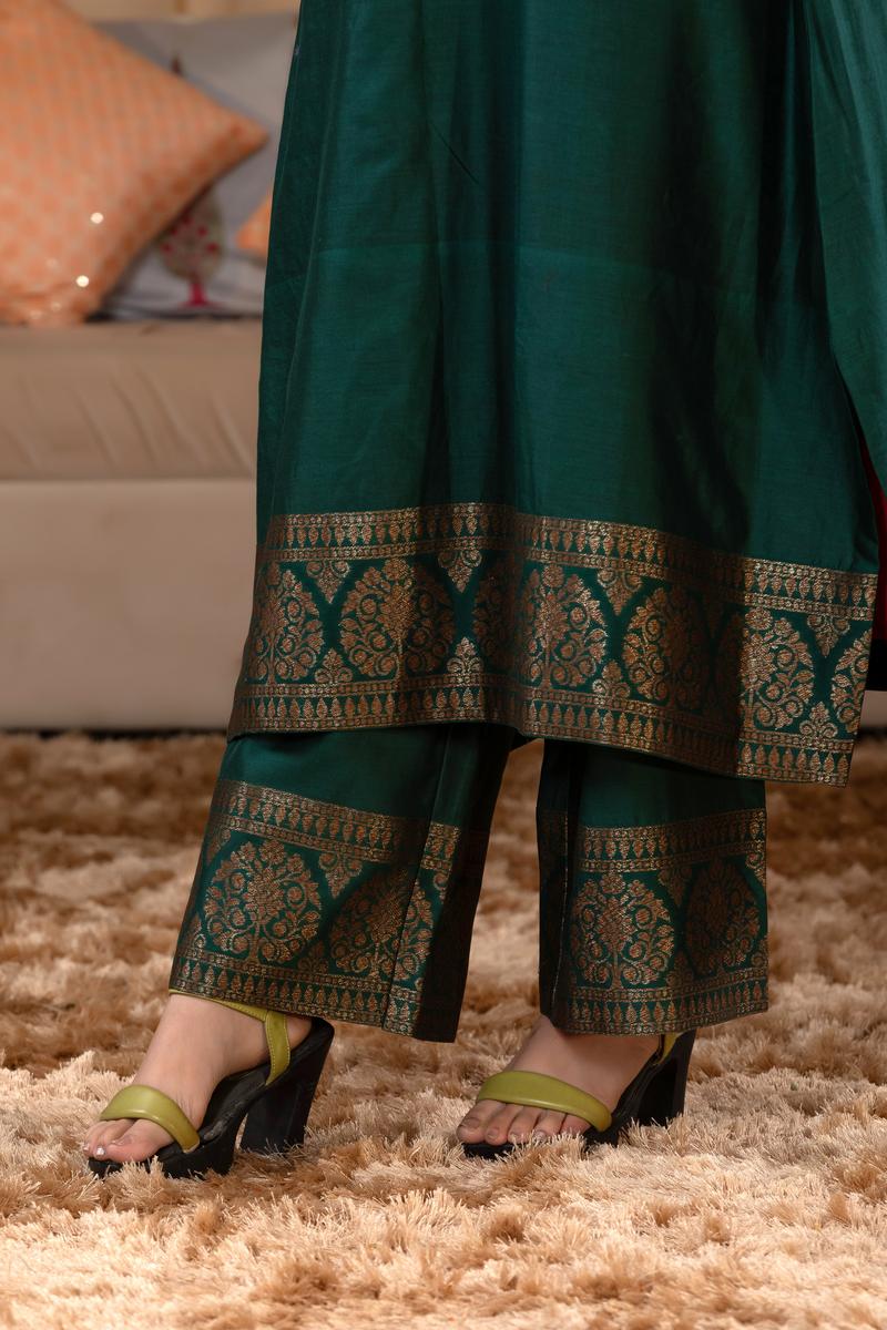 A woman in a green traditional Kurti co-ord set standing. green Wedding Kurti Salwar Suit  close view