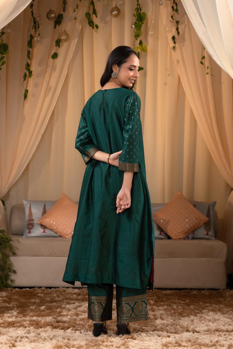 A woman in a green traditional Kurti co-ord set standing. green Wedding Kurti Salwar Suit 