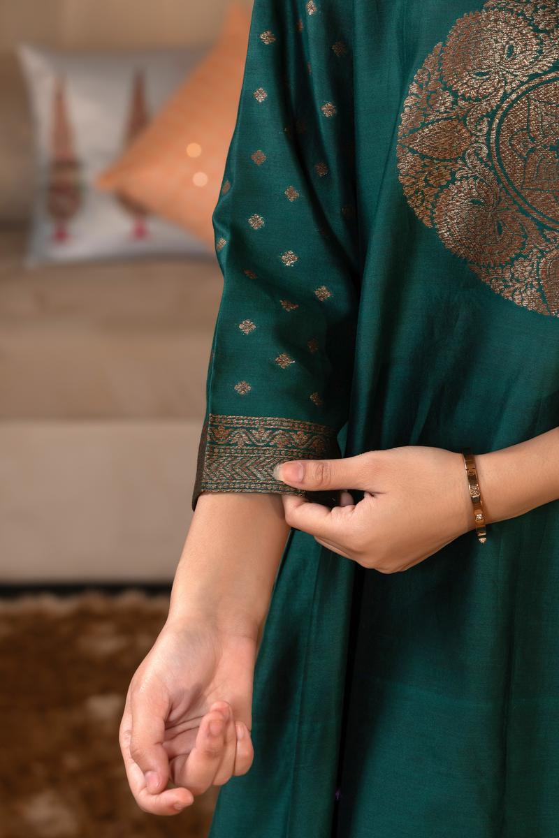 A woman in a green traditional Kurti co-ord set standing. green Wedding Kurti Salwar Suit 