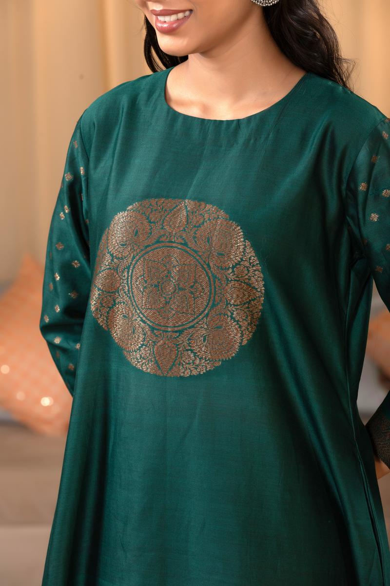 A woman in a green traditional Kurti co-ord set standing. green Wedding Kurti Salwar Suit 