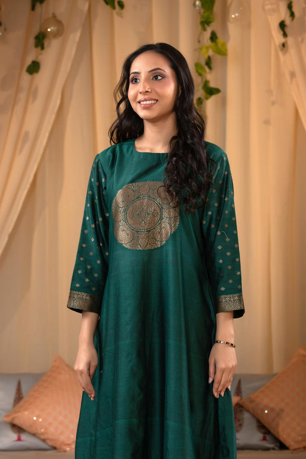 A woman in a green traditional Kurti co-ord set standing. green Wedding Kurti Salwar Suit 