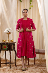 A woman in a pink Indo-Western dress, paired with a matching coat featuring pichwai motifs.