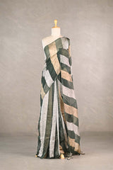 Sage Green gold and silver checkered organza silk tissue saree draped on a mannequin against a gray background