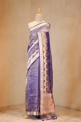 A Blue party wear tissue silk saree on dummy