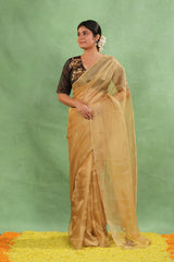 Women wearing Golden Kota Tissue Silk Saree showing cutdana and sequin buti with handcrafted lace border.