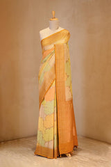 A yellow rangkat Banarasi Saree on dummy
