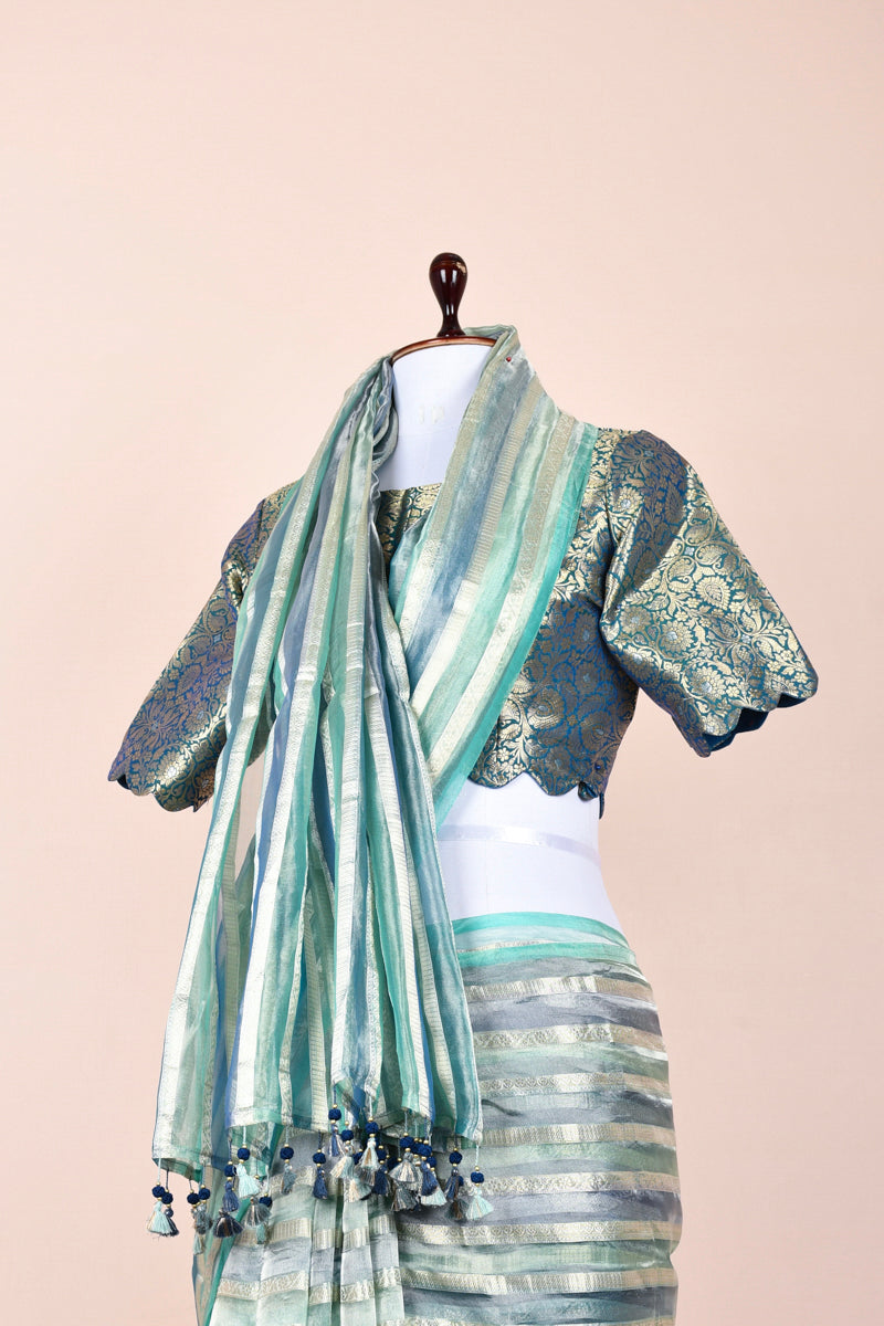 Aqua Blue Striped Rangkat Tissue Silk Saree With Stitched Blouse