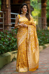 Indian women draped  beautifully Bright Yellow Meenadar Handwoven Banarasi Silk Saree by chinaya banaras