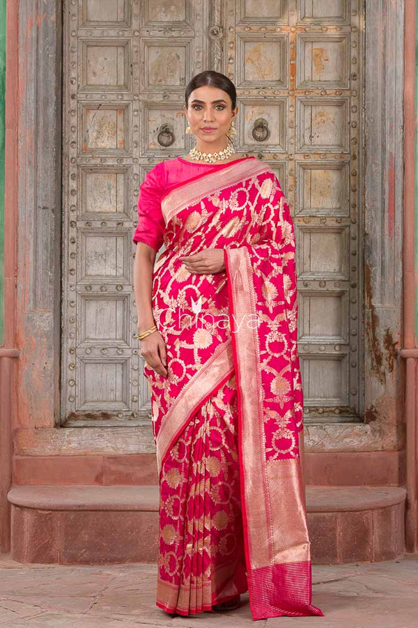 Indian women draped  beautifully Rosewood Jaal Deep Pink Banarasi Silk Saree by chinaya banaras